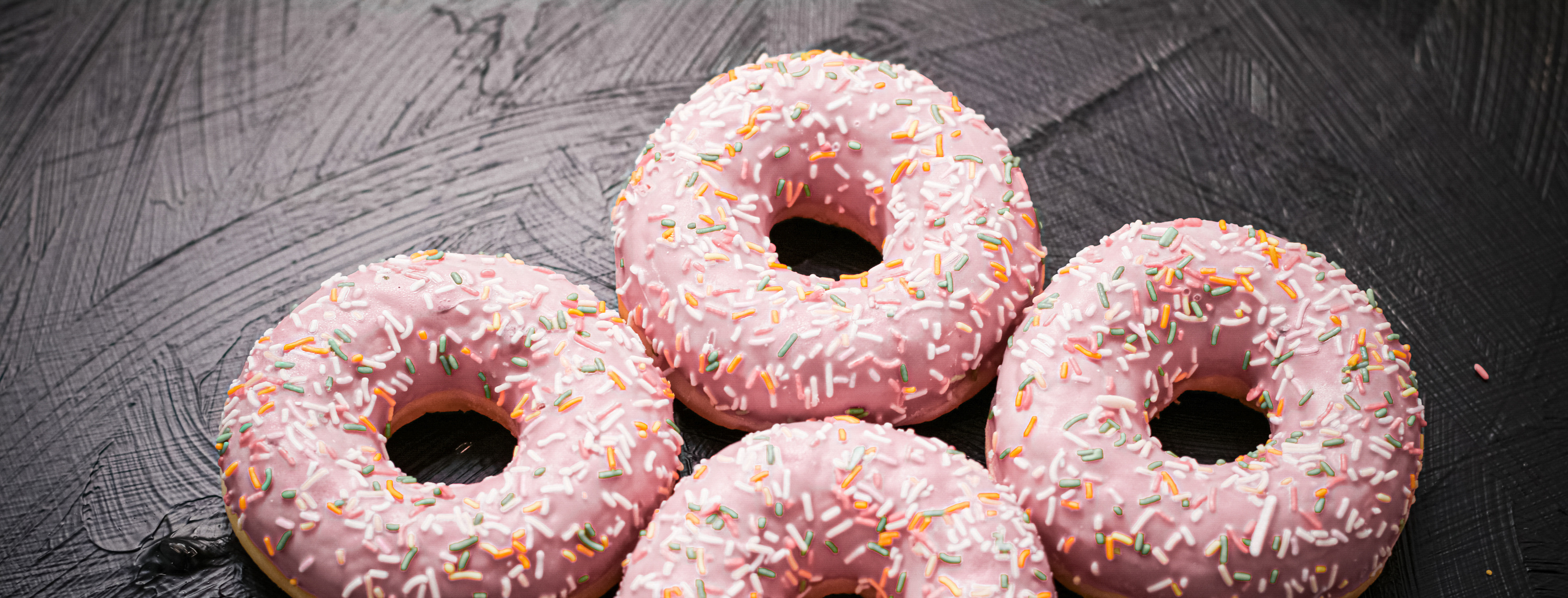 Frosted Sprinkled Donuts, Sweet Pastry Dessert on Rustic Wooden Background, Doughnuts as Tasty Snack, Top View Food Brand Flat Lay for Blog, Menu or Cookbook Design